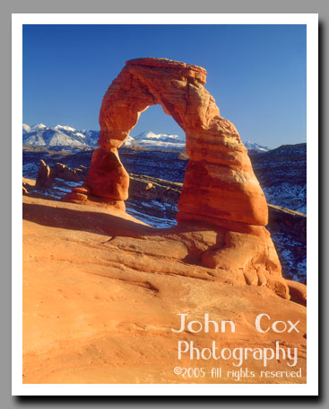 Delicate Arch glows in the light of a setting sun in Arches National Park, Utah.