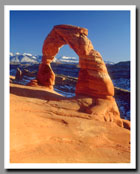 Delicate Arch glows in the light of a setting sun in Arches National Park, Utah.