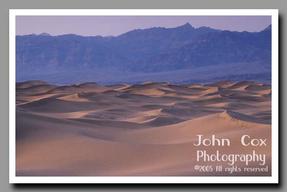 Sandy dunes resemble stormy seas in the Mesquite Flat Dunes  of Death Valley National Park in California.