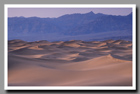 Sandy dunes resemble stormy seas in the Mesquite Flat Dunes  of Death Valley National Park in California.