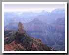 Light mists shroud the Grand Canyon from Point Imperial in Grand Canyon National Park in Arizona.