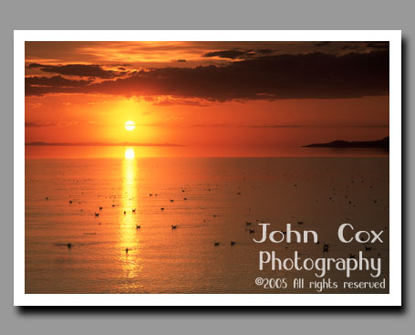 The sun sets over the Great Salt Lake in Utah.