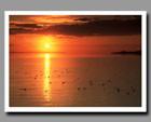 The sun sets over the Great Salt Lake in Utah.