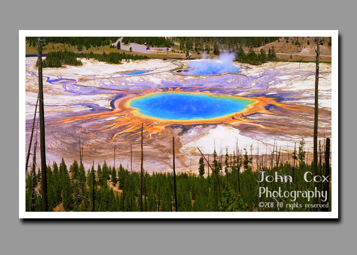 Steam rises above Grand Prismatic Spring in Yellowstone National Park in Wyoming.