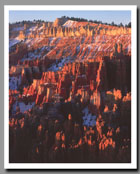 Hoodoos glow in the light of a rising sun below Sunrise Point in Bryce Canyon National Park in Utah.