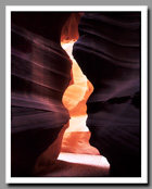 A pink wall glows through the narrows of Upper Antelope Canyon outside of Page, Arizona.