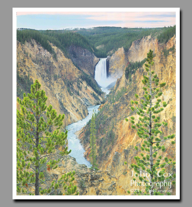 Yellowstone Falls fill the far reaches of the Grand Canyon of the Yellowstone with mist.
